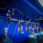 Valves, gas manifolds, gas dispensing stations